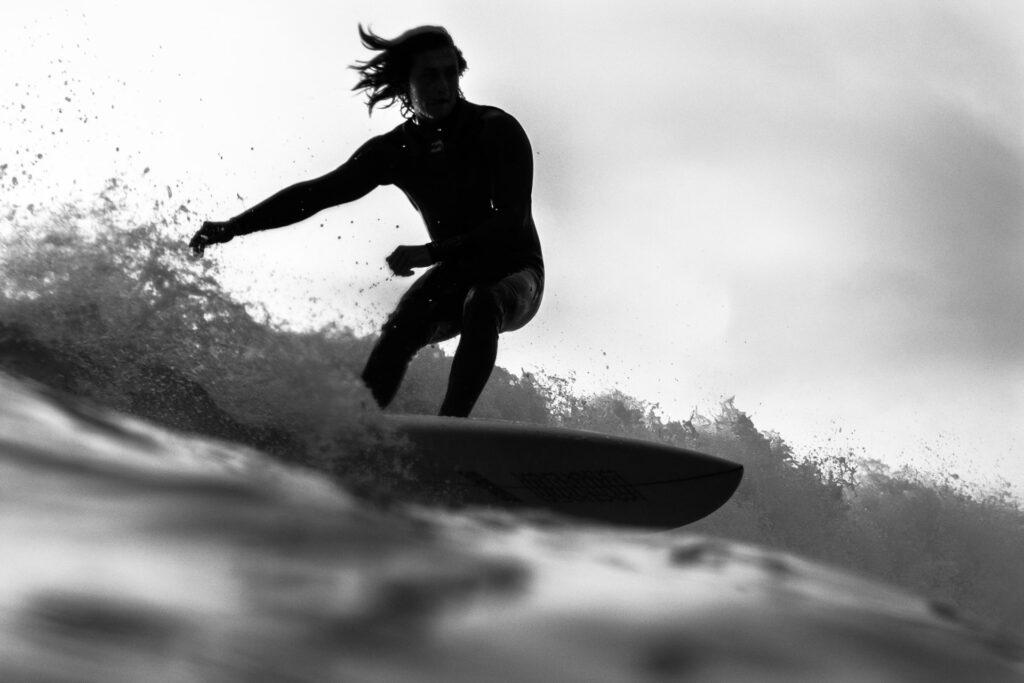 man_on_surfboard_silhouette